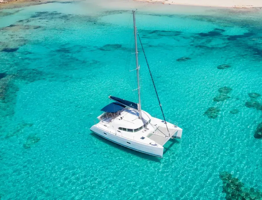 lagoon 380 in balos lagoon blue water aerial photo